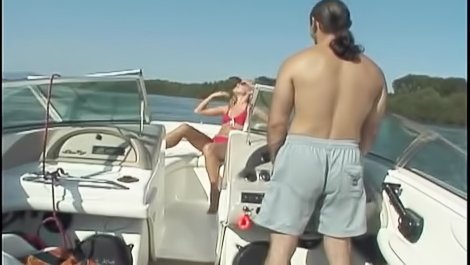 Tanned blonde is fucking on the boat