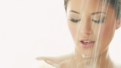 Tender brunette is taking shower